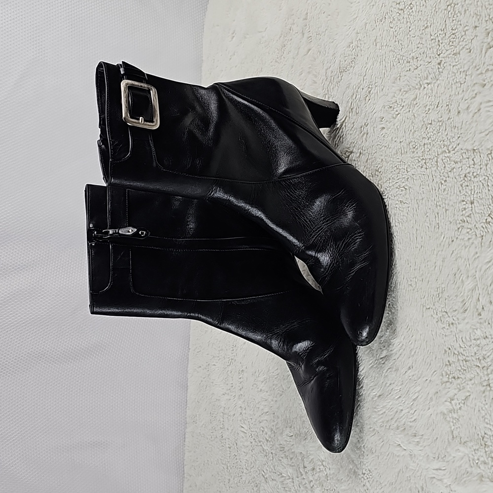 Cole Haan black leather heeled boots.